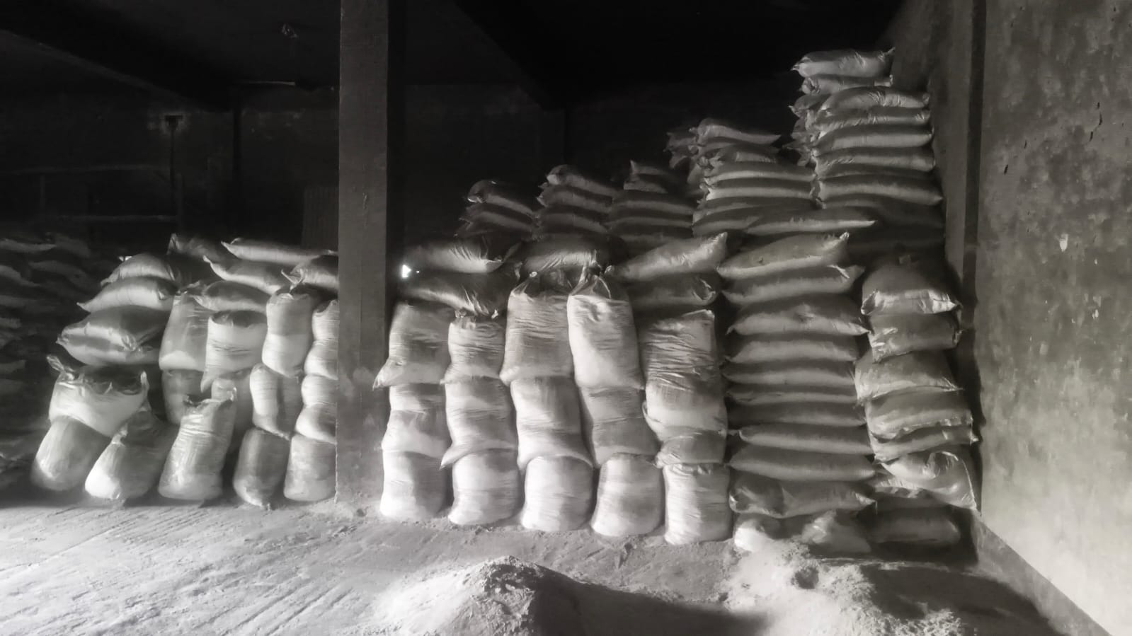 Stacked sacks of packaged material in the Kolkata storage area